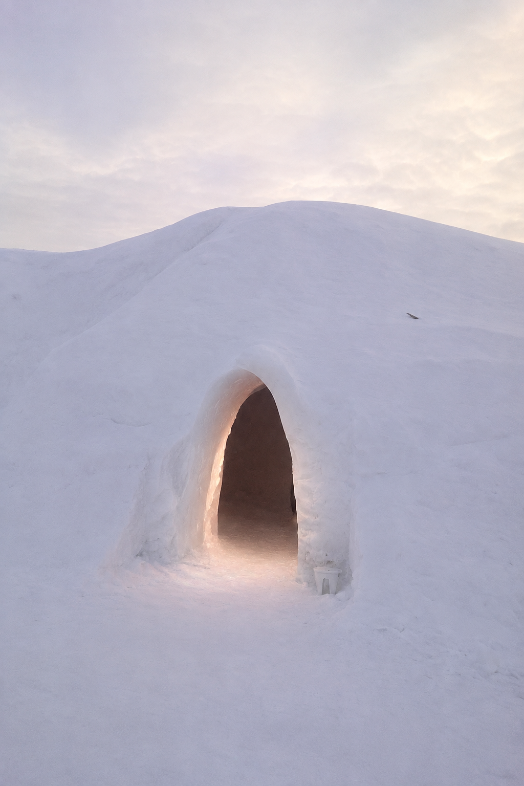 Igloo with a subtle glow at the doorway